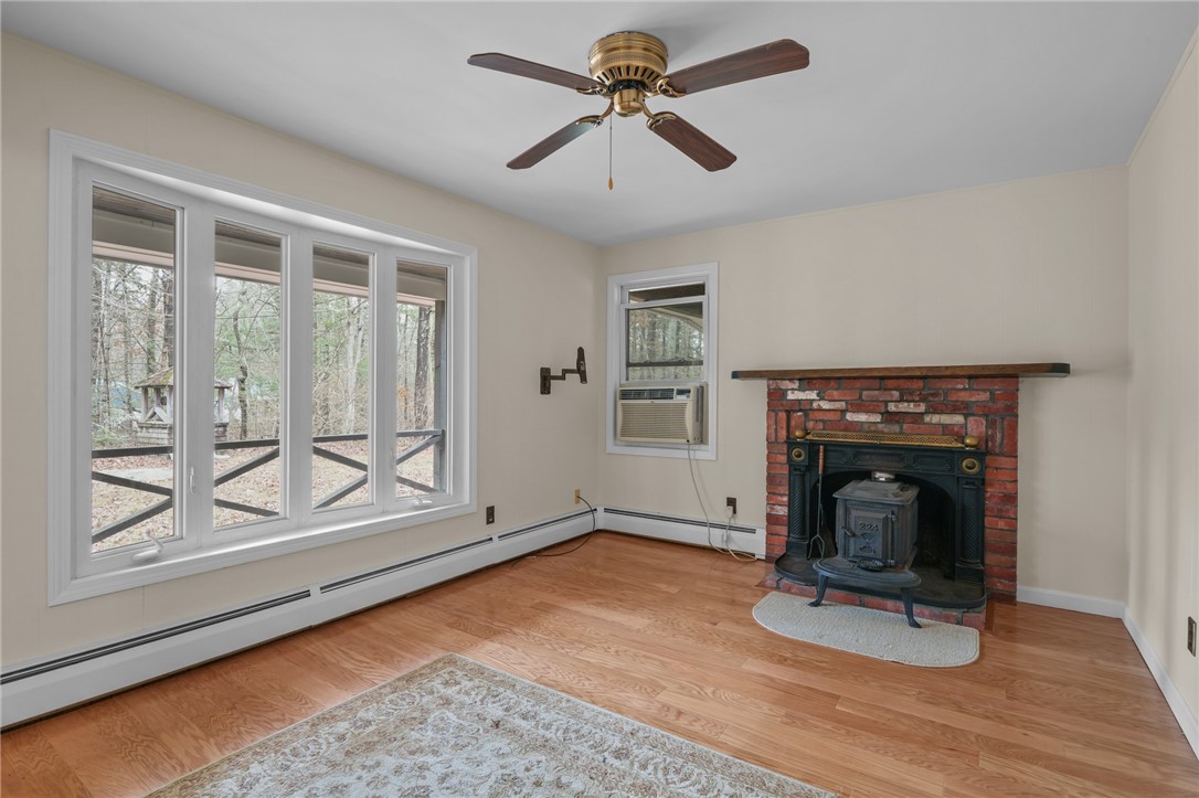 30 Sheffield Hill Road Exeter, RI 02822 - Photo 12 of 42 Family room with wood stove