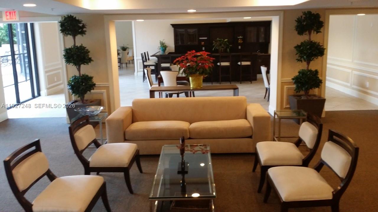55 Merrick Way, Unit 505 Coral Gables, FL 33134 - Photo 11 of 15 a living room with furniture and a window