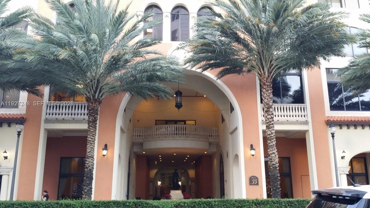 55 Merrick Way, Unit 505 Coral Gables, FL 33134 - Photo 12 of 15 a view of a building with a tree