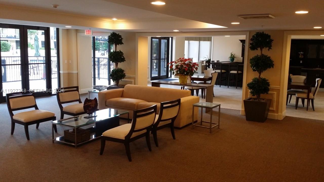 55 Merrick Way, Unit 505 Coral Gables, FL 33134 - Photo 15 of 15 a living room with furniture and a large window
