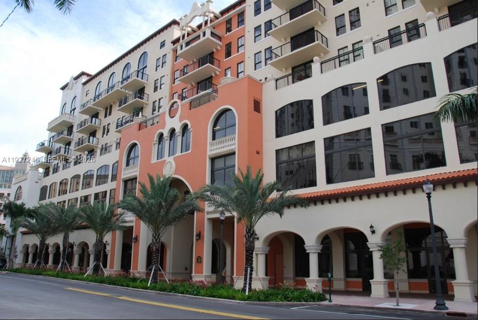 55 Merrick Way, Unit 505 Coral Gables, FL 33134 - Photo 3 of 15 a view of building with a lot of windows