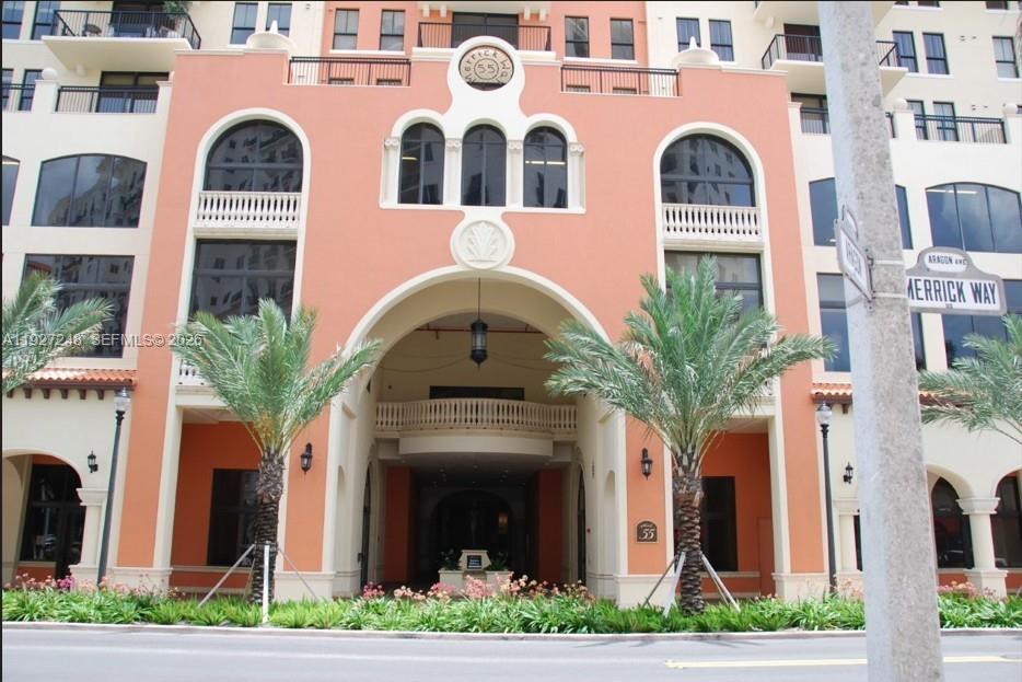 55 Merrick Way, Unit 505 Coral Gables, FL 33134 - Photo 4 of 15 a front view of a house with a garden