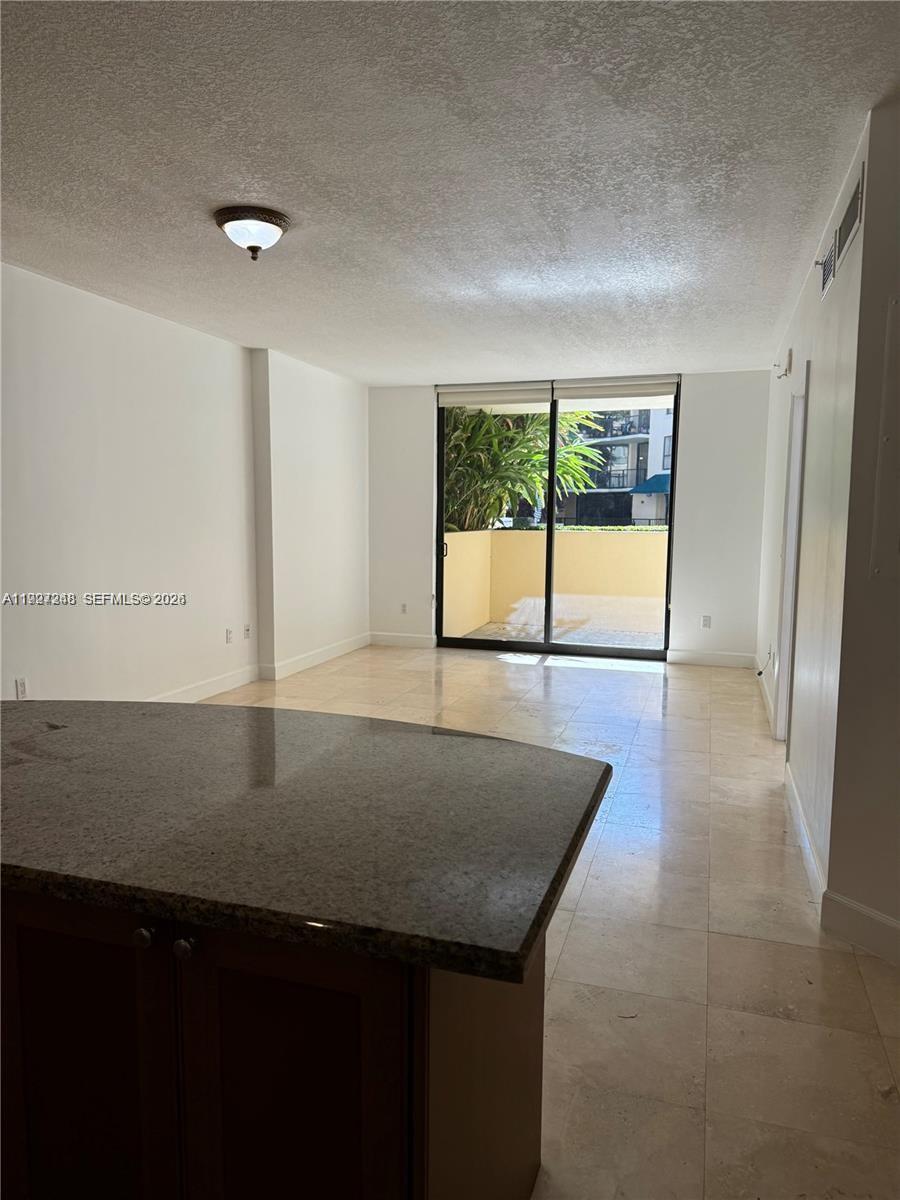 55 Merrick Way, Unit 505 Coral Gables, FL 33134 - Photo 5 of 15 wooden floor in an empty room with a window