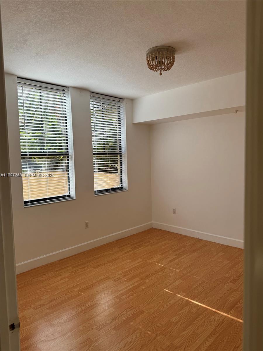 55 Merrick Way, Unit 505 Coral Gables, FL 33134 - Photo 10 of 15 a view of an empty room with a window
