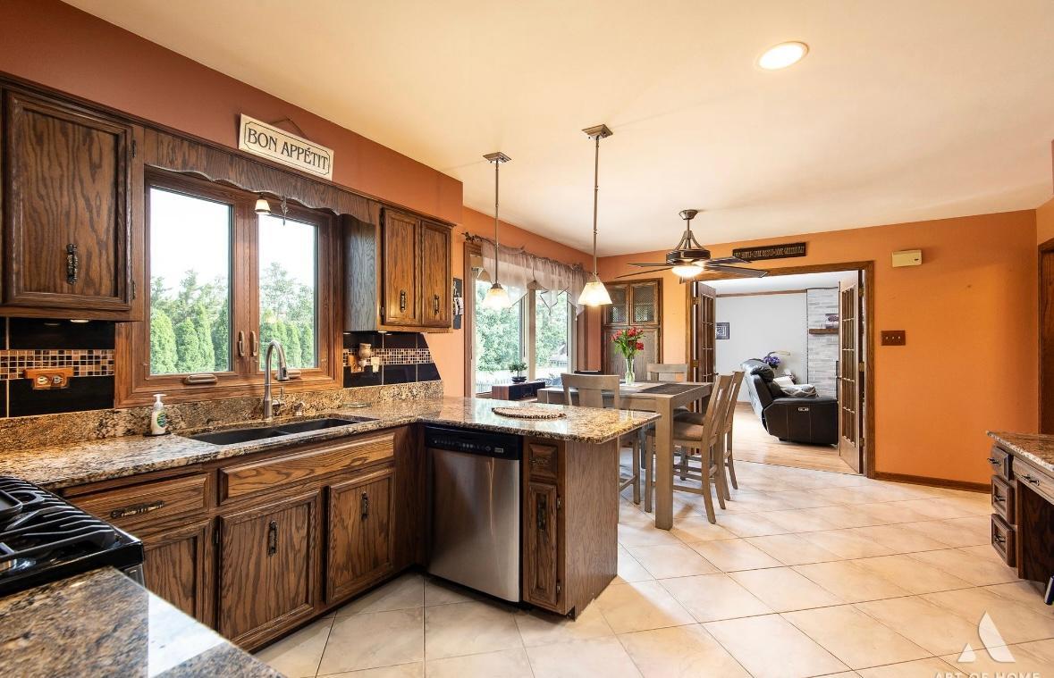 12809 Brian Place Palos Park, IL 60464 - Photo 12 of 31 a kitchen with a sink stove and cabinets