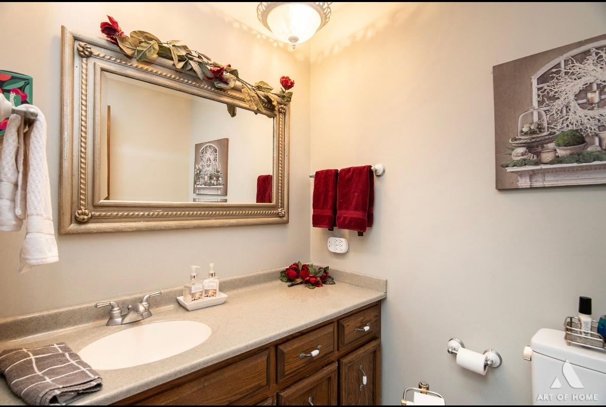 12809 Brian Place Palos Park, IL 60464 - Photo 19 of 31 a bathroom with a sink vanity and a mirror