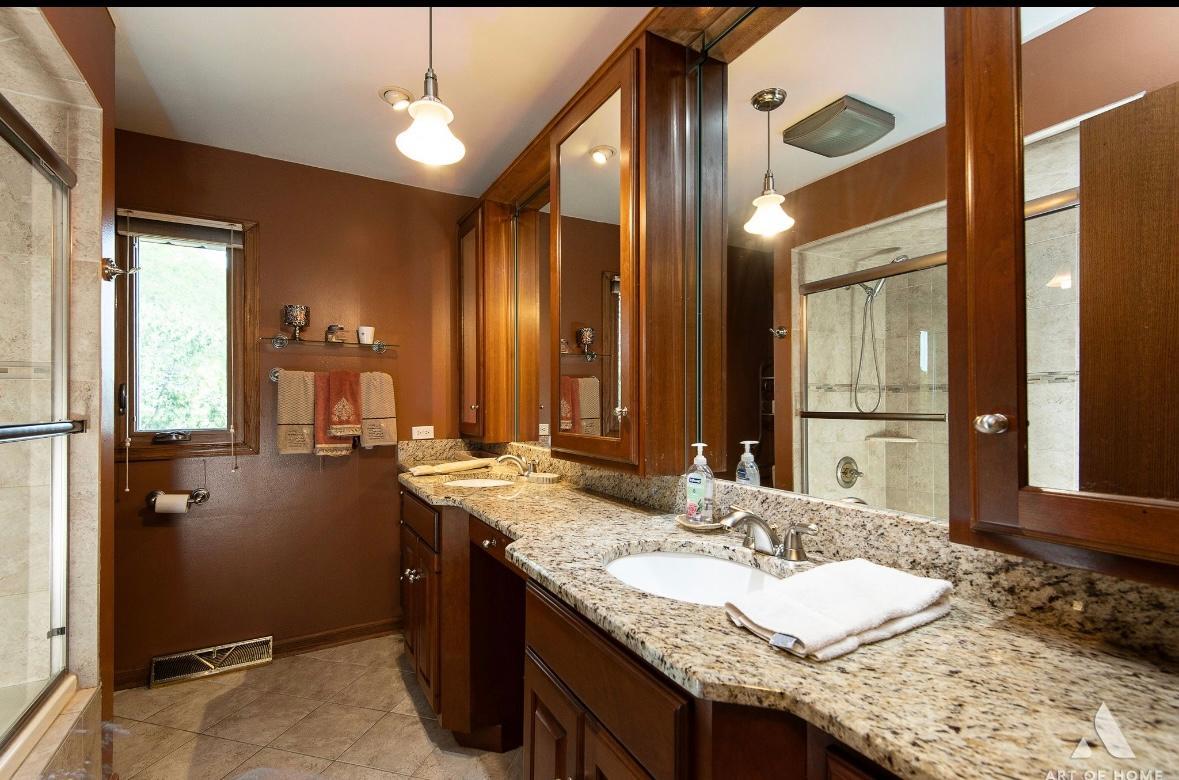 12809 Brian Place Palos Park, IL 60464 - Photo 20 of 31 a bathroom with a granite countertop sink and a mirror