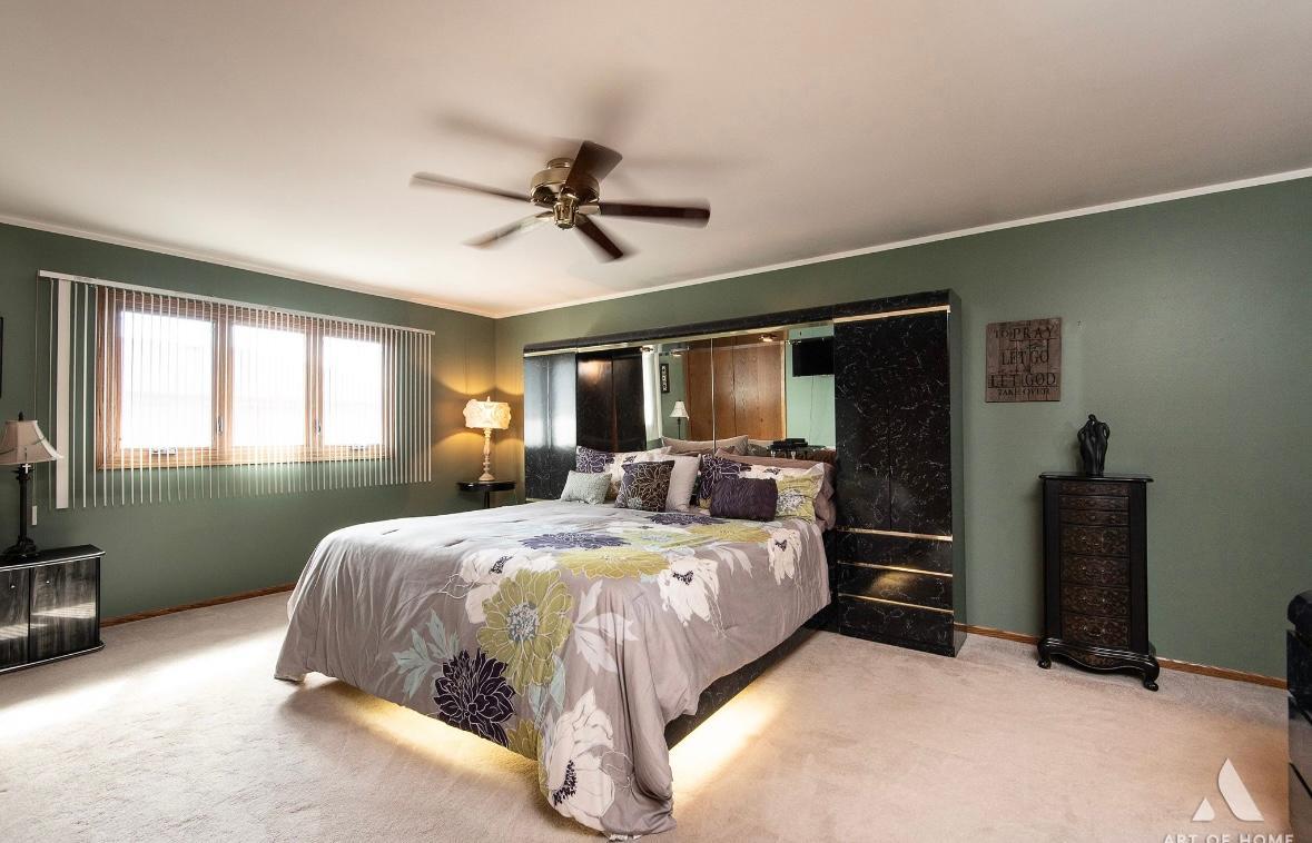 12809 Brian Place Palos Park, IL 60464 - Photo 23 of 31 a bedroom with a bed flat screen tv and window