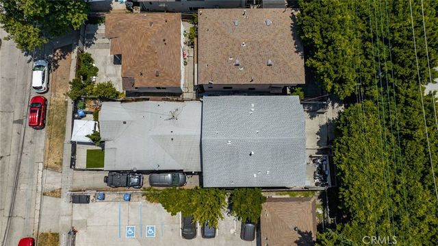 an aerial view of residential houses with outdoor space