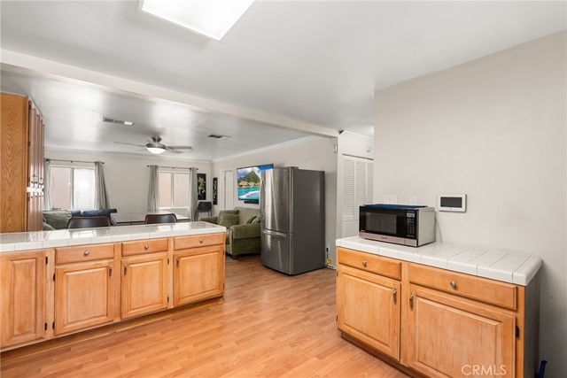 a kitchen with a sink stove and refrigerator