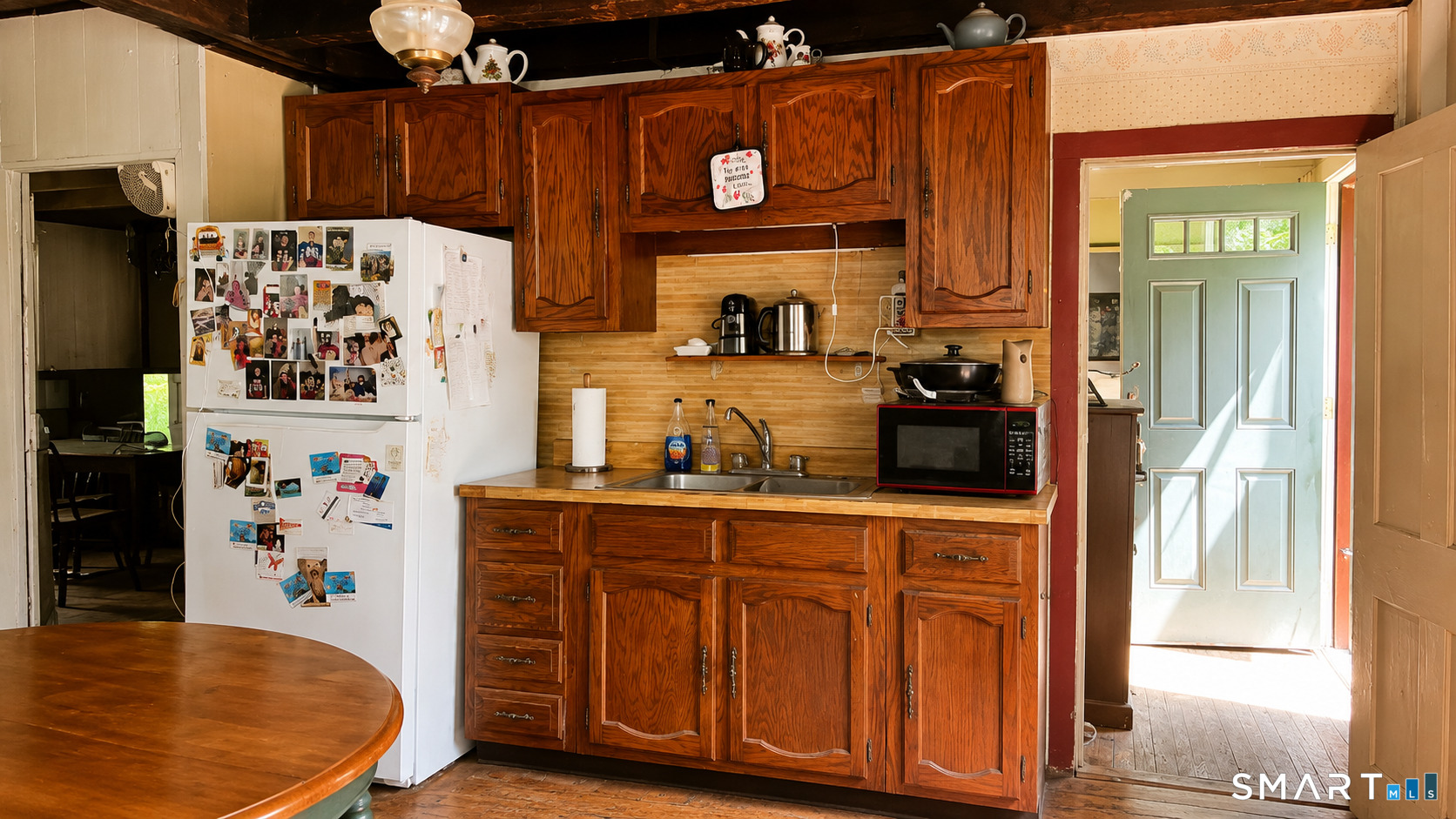 136 Norwich-Lebanon Road Franklin, CT 06254 - Photo 14 of 35 Country kitchen with warm wood cabinetry.