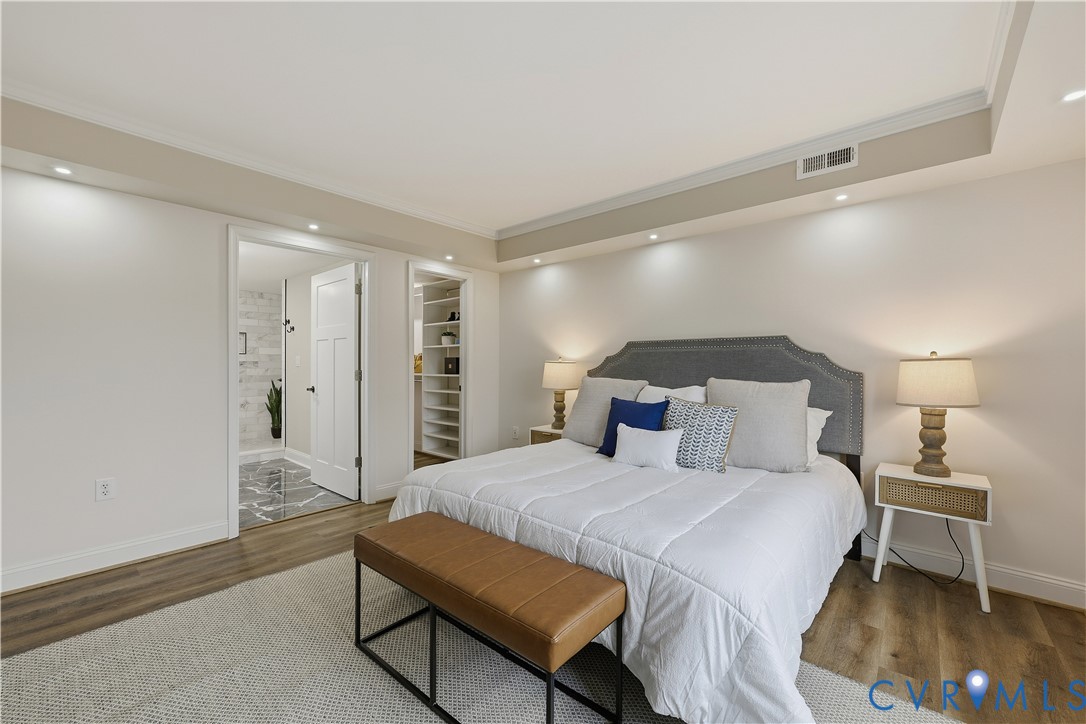 2956 Hathaway Road, Unit 609 Richmond, VA 23225 - Photo 17 of 32 a spacious bedroom with a bed and a lamp