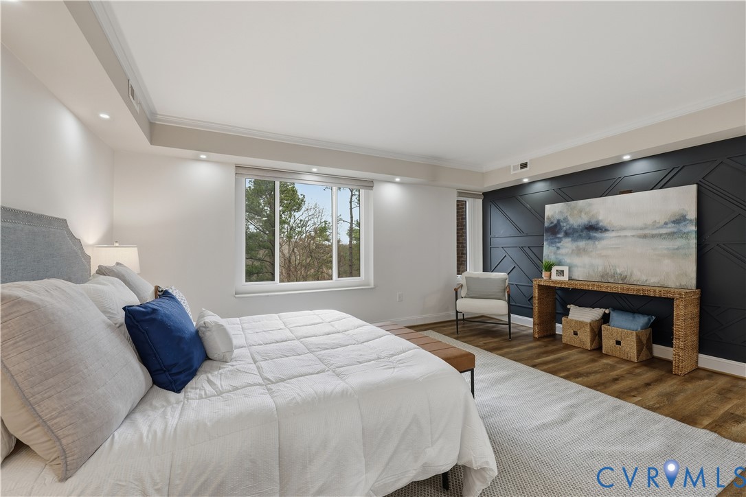 2956 Hathaway Road, Unit 609 Richmond, VA 23225 - Photo 19 of 32 a bedroom with a bed and glass windows