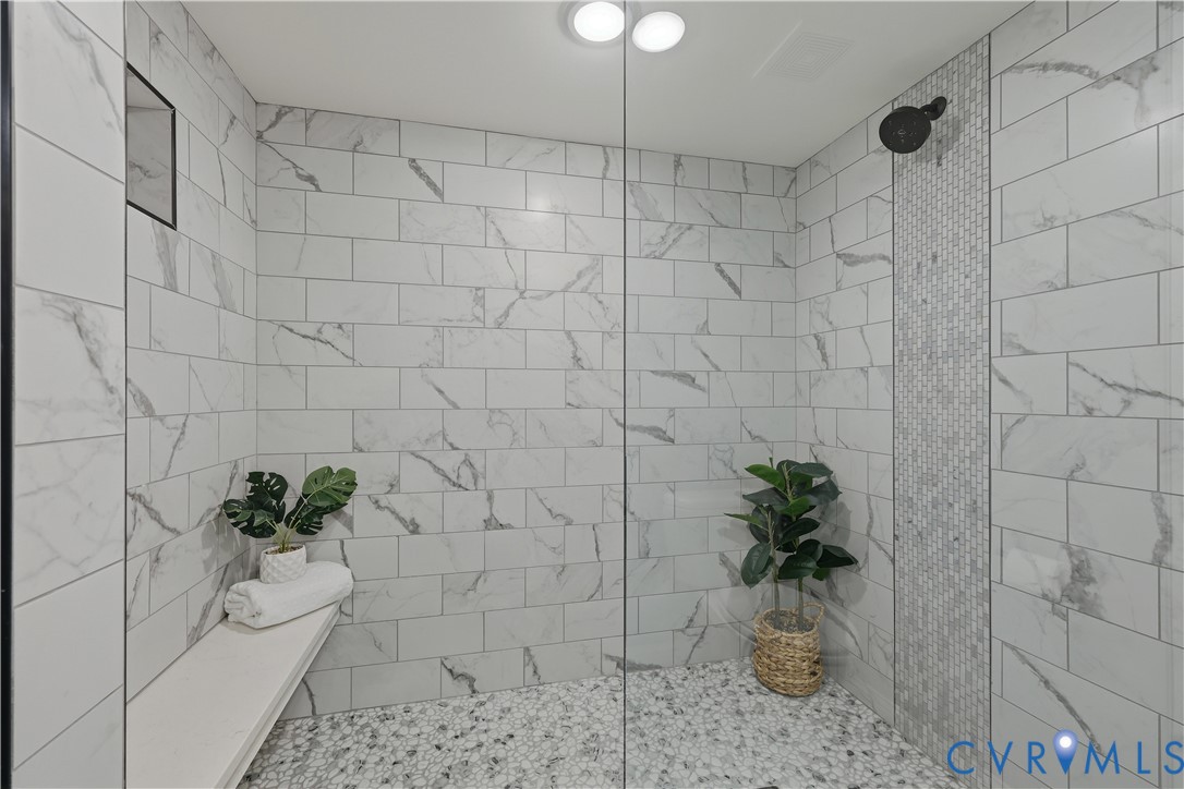 2956 Hathaway Road, Unit 609 Richmond, VA 23225 - Photo 21 of 32 a white bath tub sitting in a bathroom