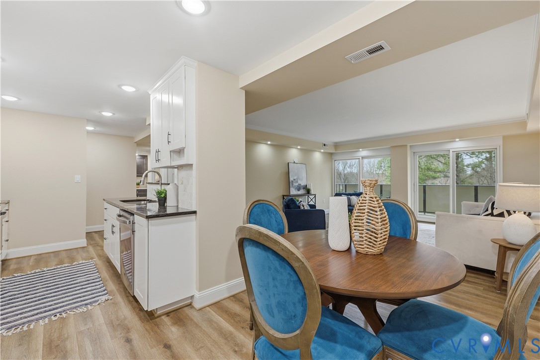 2956 Hathaway Road, Unit 609 Richmond, VA 23225 - Photo 7 of 32 a dining room with furniture and wooden floor
