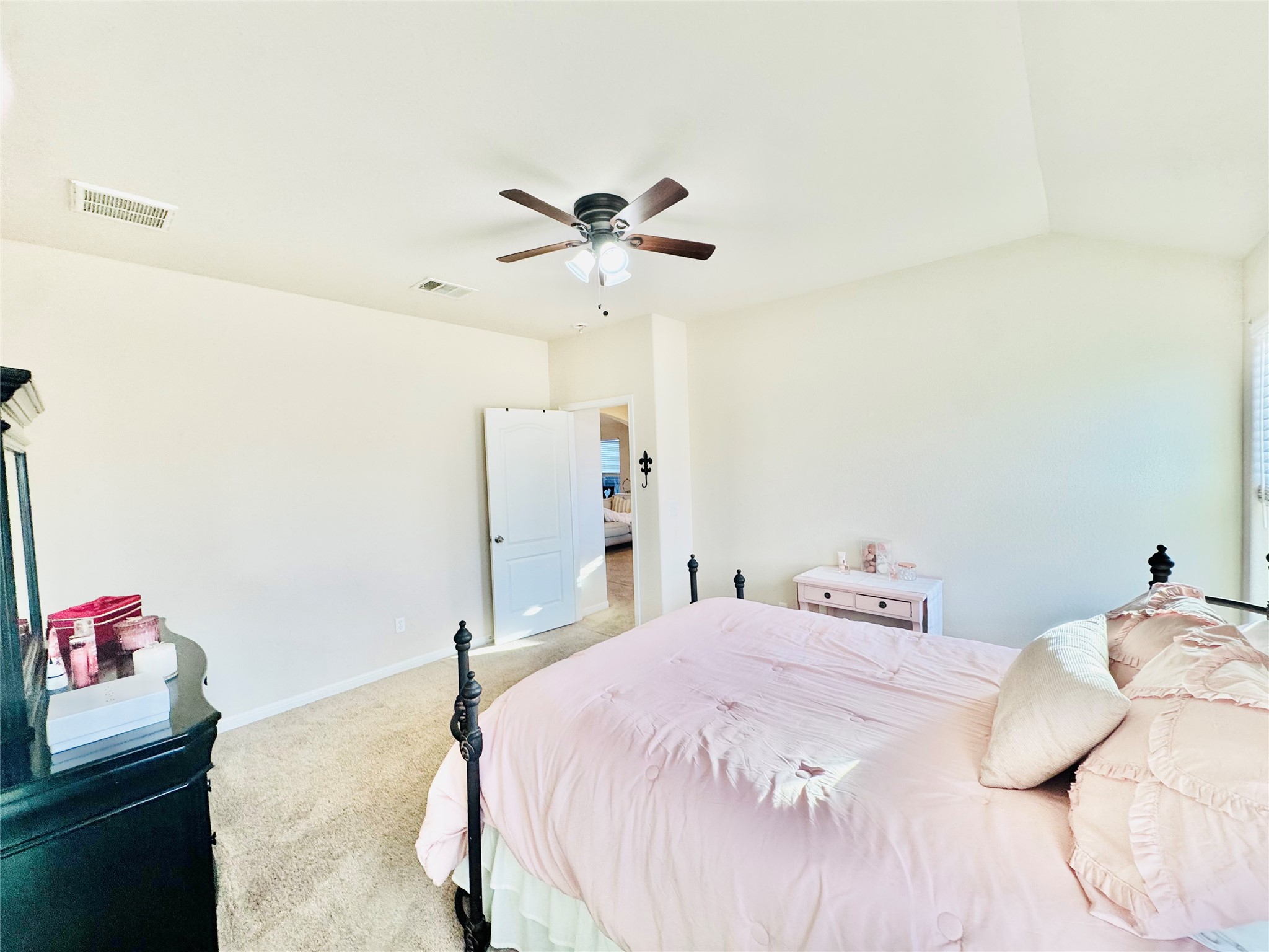 413 Gettysburg Loop Elgin, TX 78621 - Photo 25 of 32 Bedroom featuring carpet, lofted ceiling, and ceiling fan