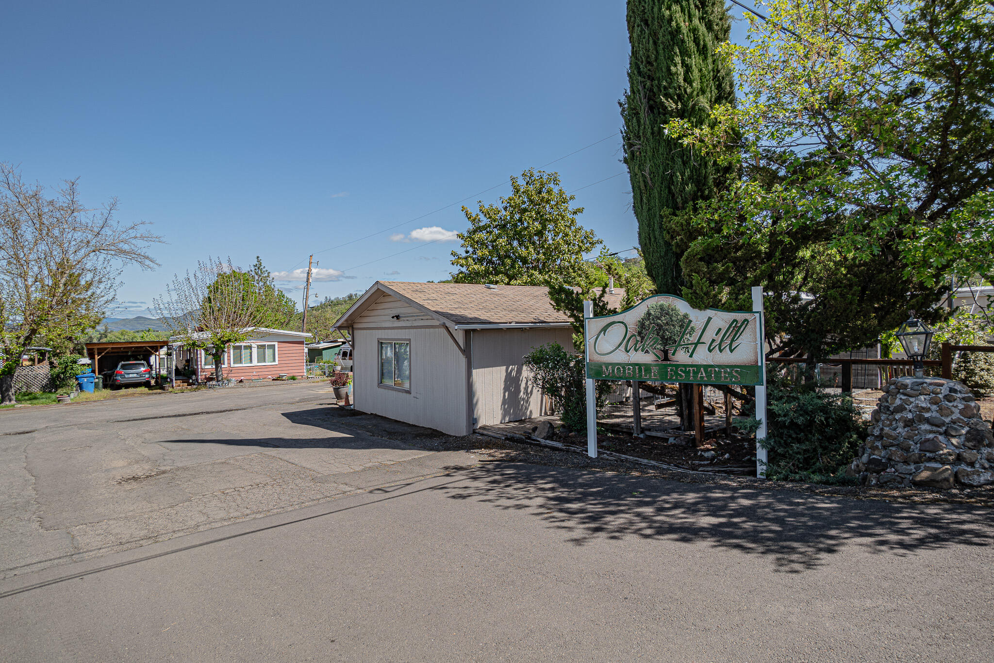 421 Stevens Road, Unit 26 Eagle Point, OR 97524 - Photo 23 of 23 a front view of a house with a yard and garage