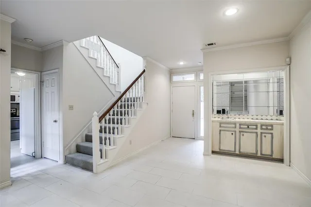 a view of a hallway with washer and dryer