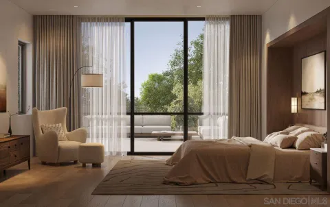 a living room with furniture and large windows