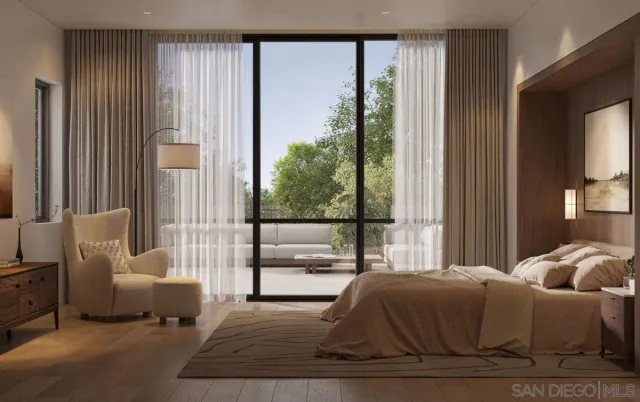 a living room with furniture and large windows