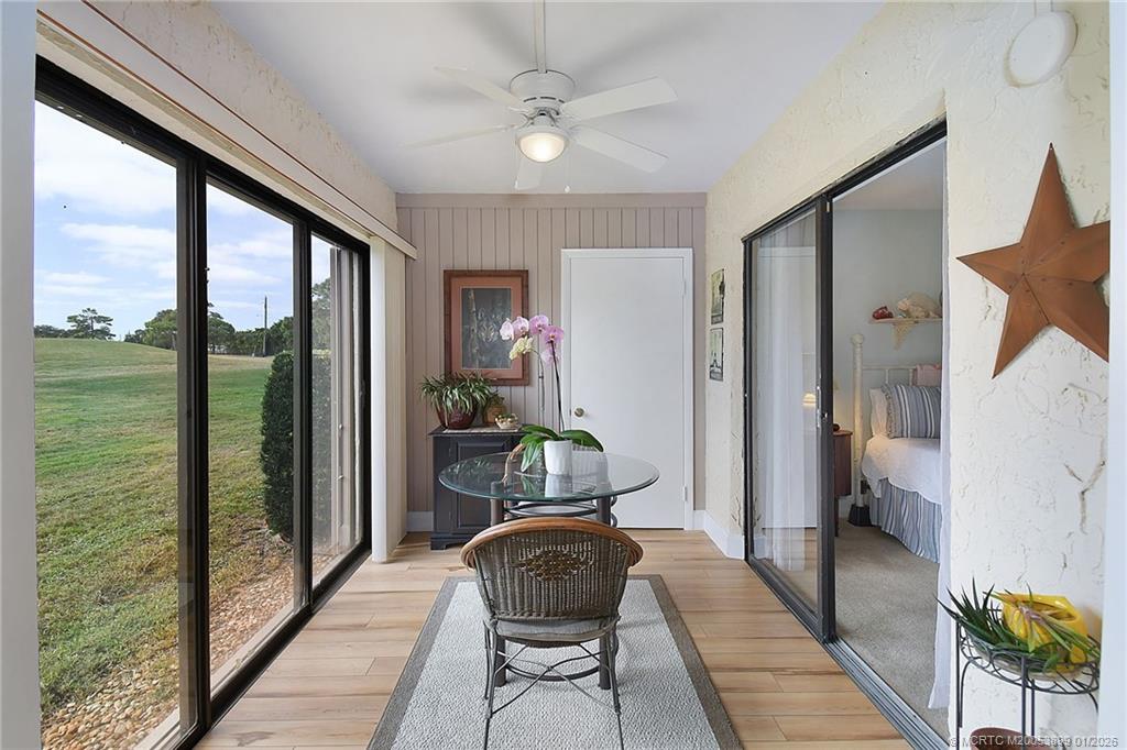 5403 Southeast Miles Grant Road, Unit H111 Stuart, FL 34997 - Photo 20 of 57 a living room with furniture and a large window