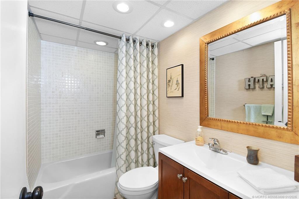 5403 Southeast Miles Grant Road, Unit H111 Stuart, FL 34997 - Photo 24 of 57 a bathroom with a sink a toilet and shower