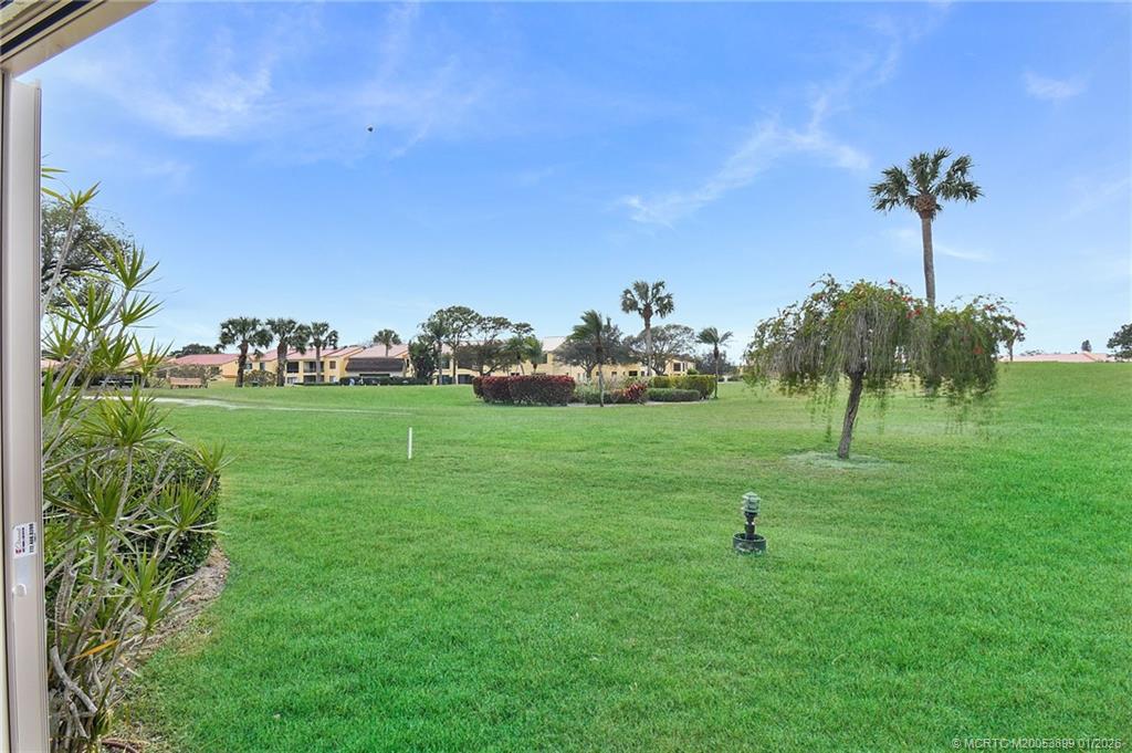 5403 Southeast Miles Grant Road, Unit H111 Stuart, FL 34997 - Photo 31 of 57 a front view of a house with garden