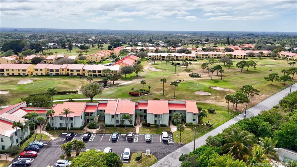 5403 Southeast Miles Grant Road, Unit H111 Stuart, FL 34997 - Photo 33 of 57 an outdoor space with lots of residential buildings ocean and mountain view in back