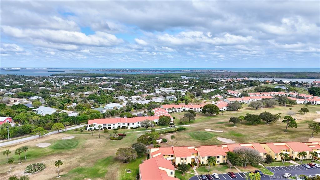 5403 Southeast Miles Grant Road, Unit H111 Stuart, FL 34997 - Photo 41 of 57 an aerial view of residential houses with outdoor space