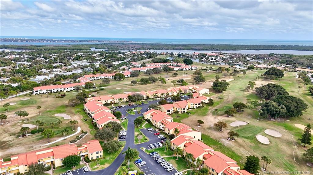 5403 Southeast Miles Grant Road, Unit H111 Stuart, FL 34997 - Photo 45 of 57 an aerial view of city and lake