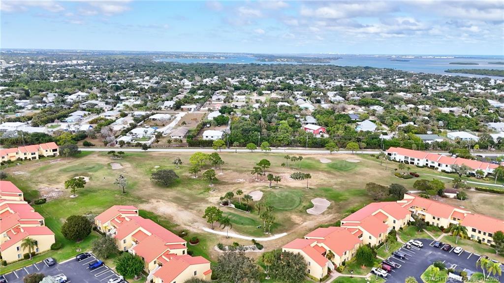 5403 Southeast Miles Grant Road, Unit H111 Stuart, FL 34997 - Photo 48 of 57 an aerial view of residential houses with outdoor space