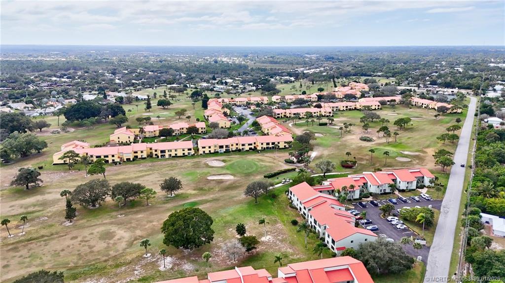 5403 Southeast Miles Grant Road, Unit H111 Stuart, FL 34997 - Photo 50 of 57 an aerial view of residential houses with outdoor space