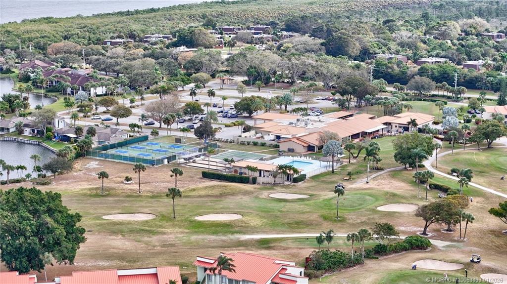 5403 Southeast Miles Grant Road, Unit H111 Stuart, FL 34997 - Photo 55 of 57 an aerial view of residential houses with outdoor space