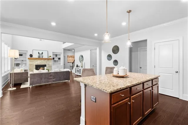 a large kitchen with kitchen island a large counter space