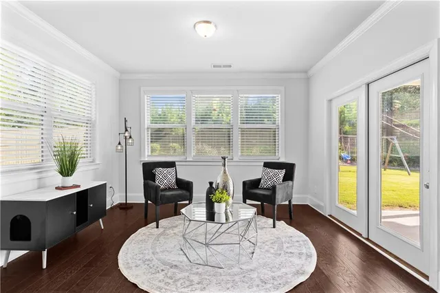 a view of a dining room with furniture window and wooden floor