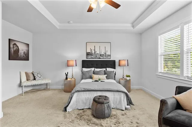 a bedroom with furniture and a large window