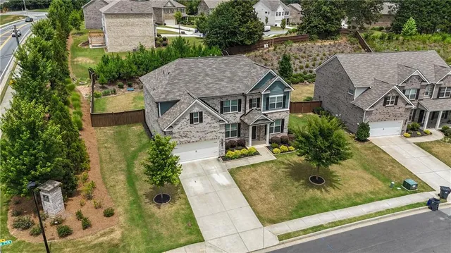 an aerial view of a house with swimming pool