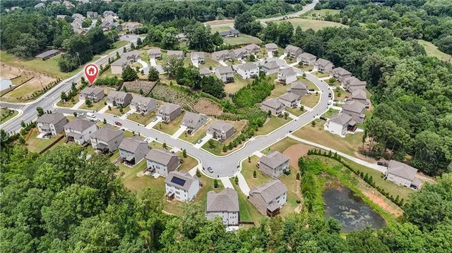 an aerial view of a house with a garden