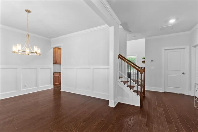 a view of an entryway with wooden floor