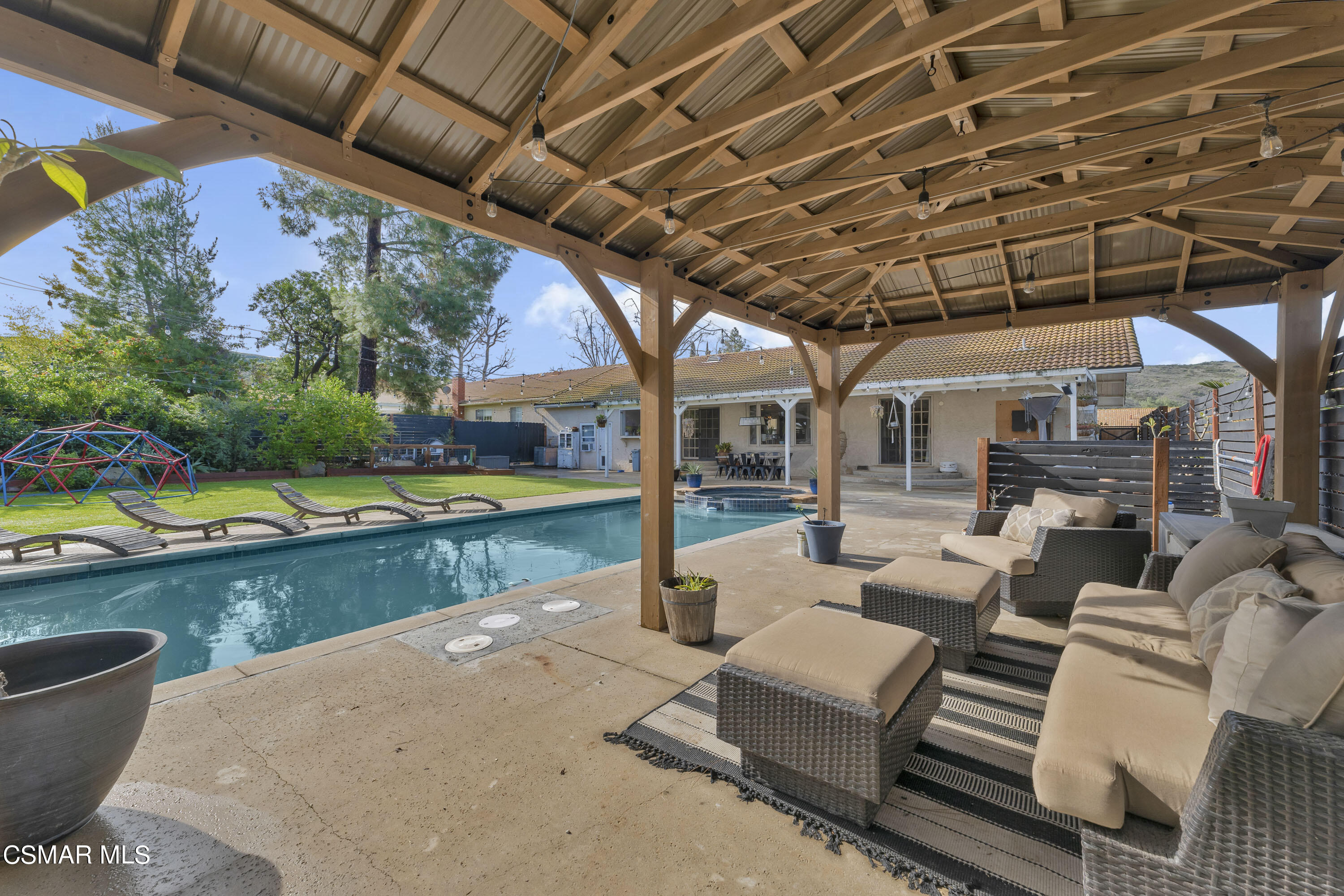 1065 Rambling Road Simi Valley, CA 93065 - Photo 18 of 54 a view of a patio with chairs and a yard