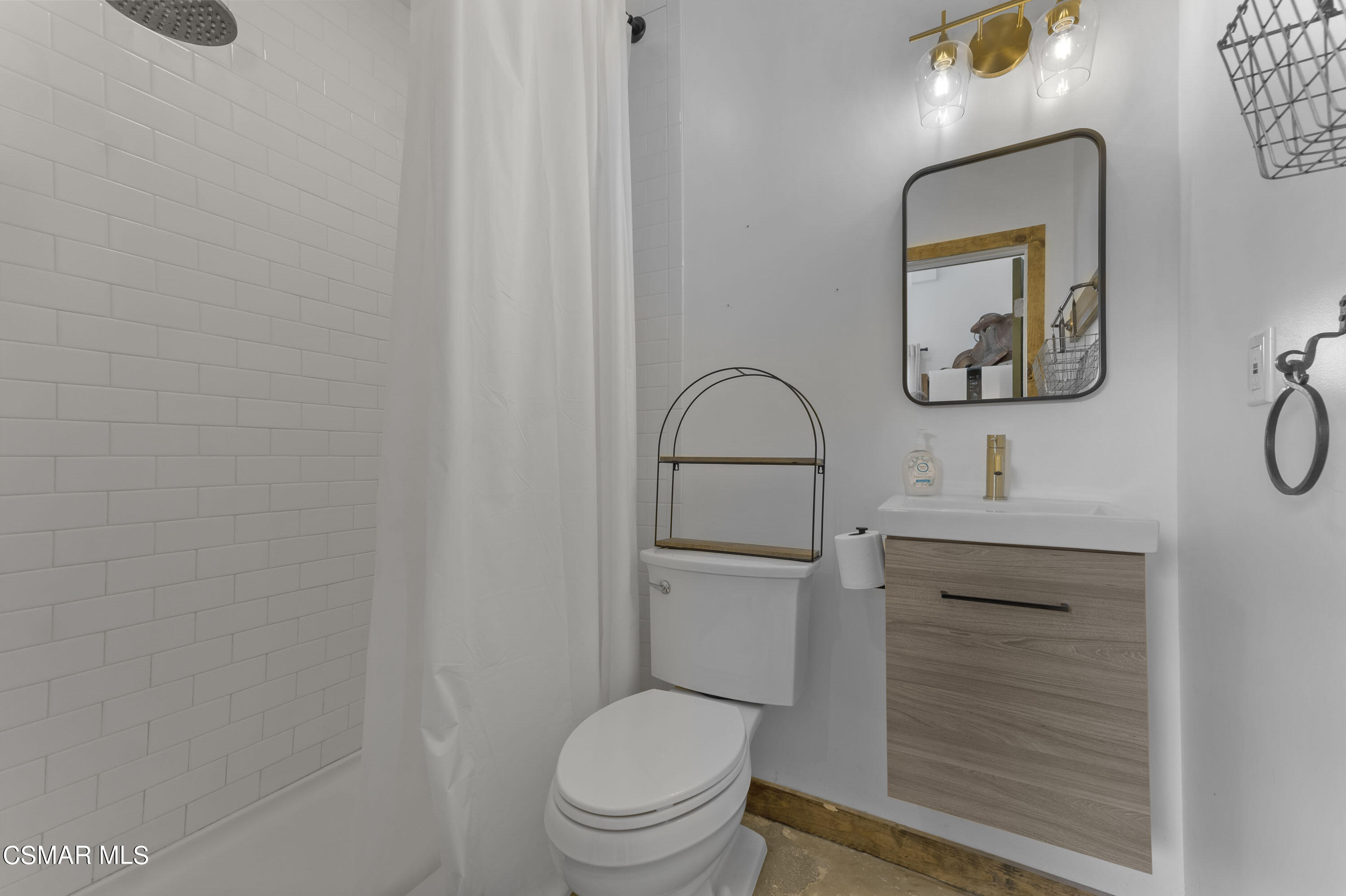 1065 Rambling Road Simi Valley, CA 93065 - Photo 25 of 54 a bathroom with a toilet a sink and mirror