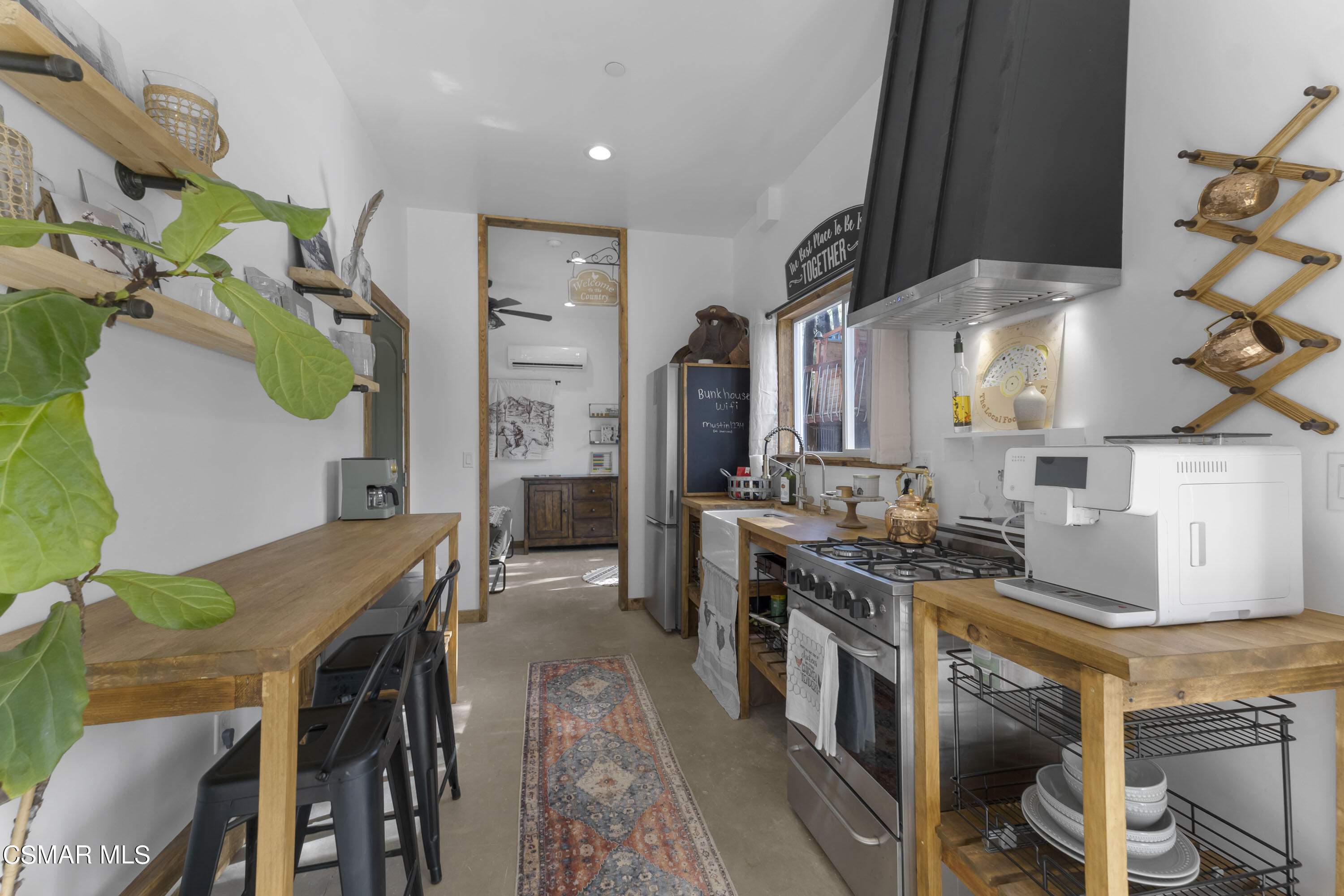 1065 Rambling Road Simi Valley, CA 93065 - Photo 27 of 54 a kitchen with stainless steel appliances granite countertop a stove a sink dishwasher and cabinets with wooden floor