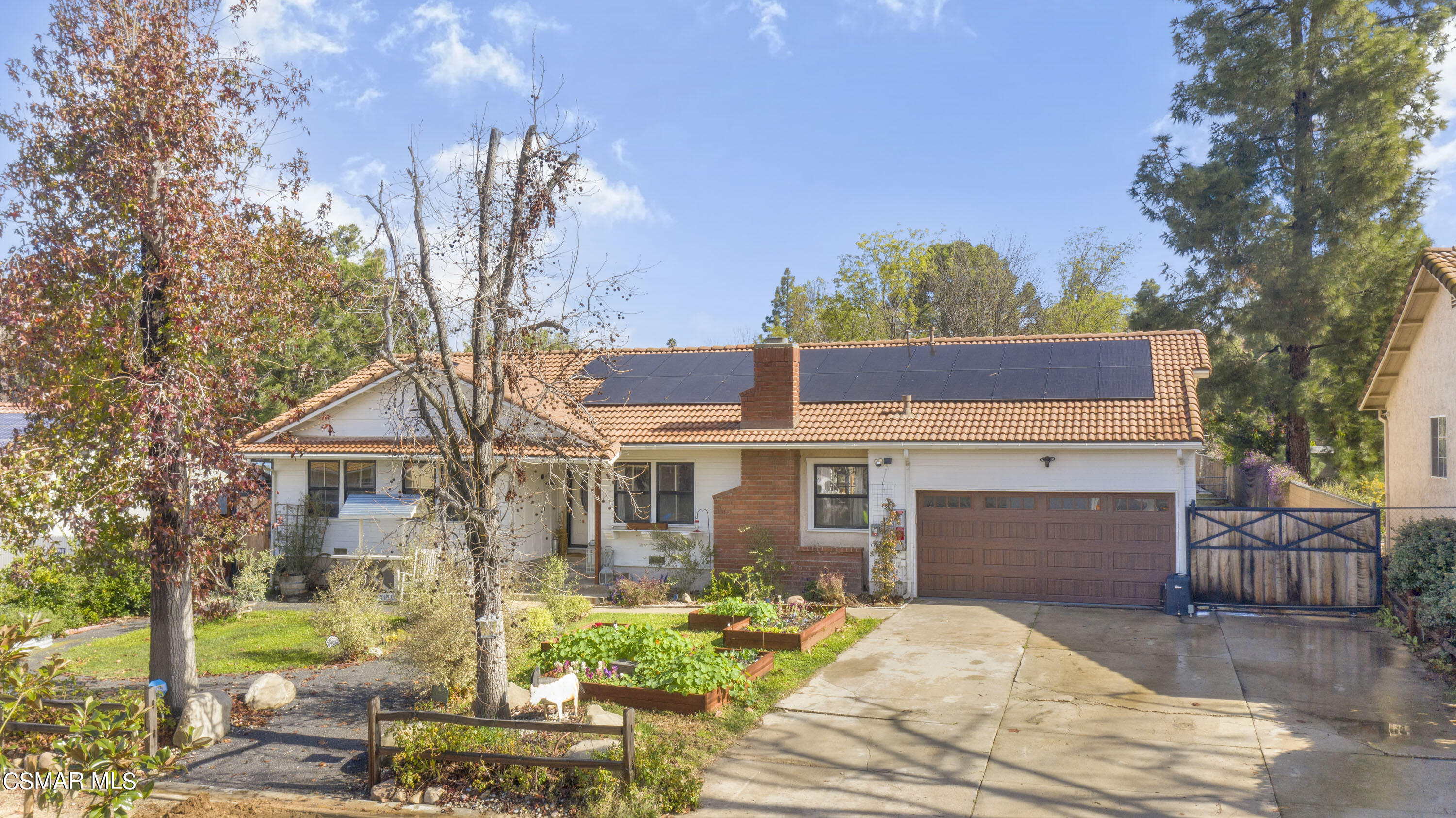 1065 Rambling Road Simi Valley, CA 93065 - Photo 32 of 54 a front view of a house with garden