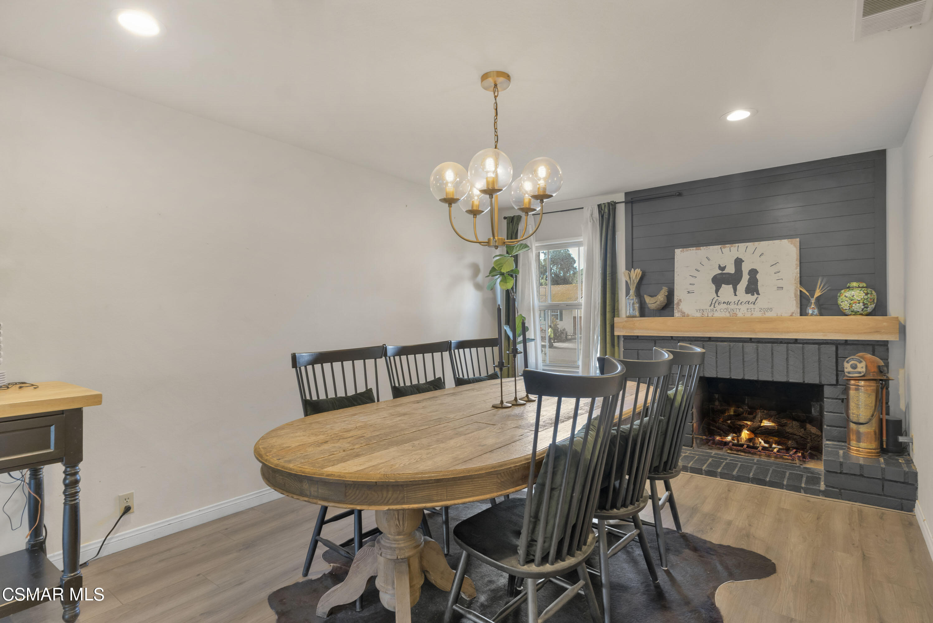 1065 Rambling Road Simi Valley, CA 93065 - Photo 4 of 54 a view of a dining room with furniture and wooden floor