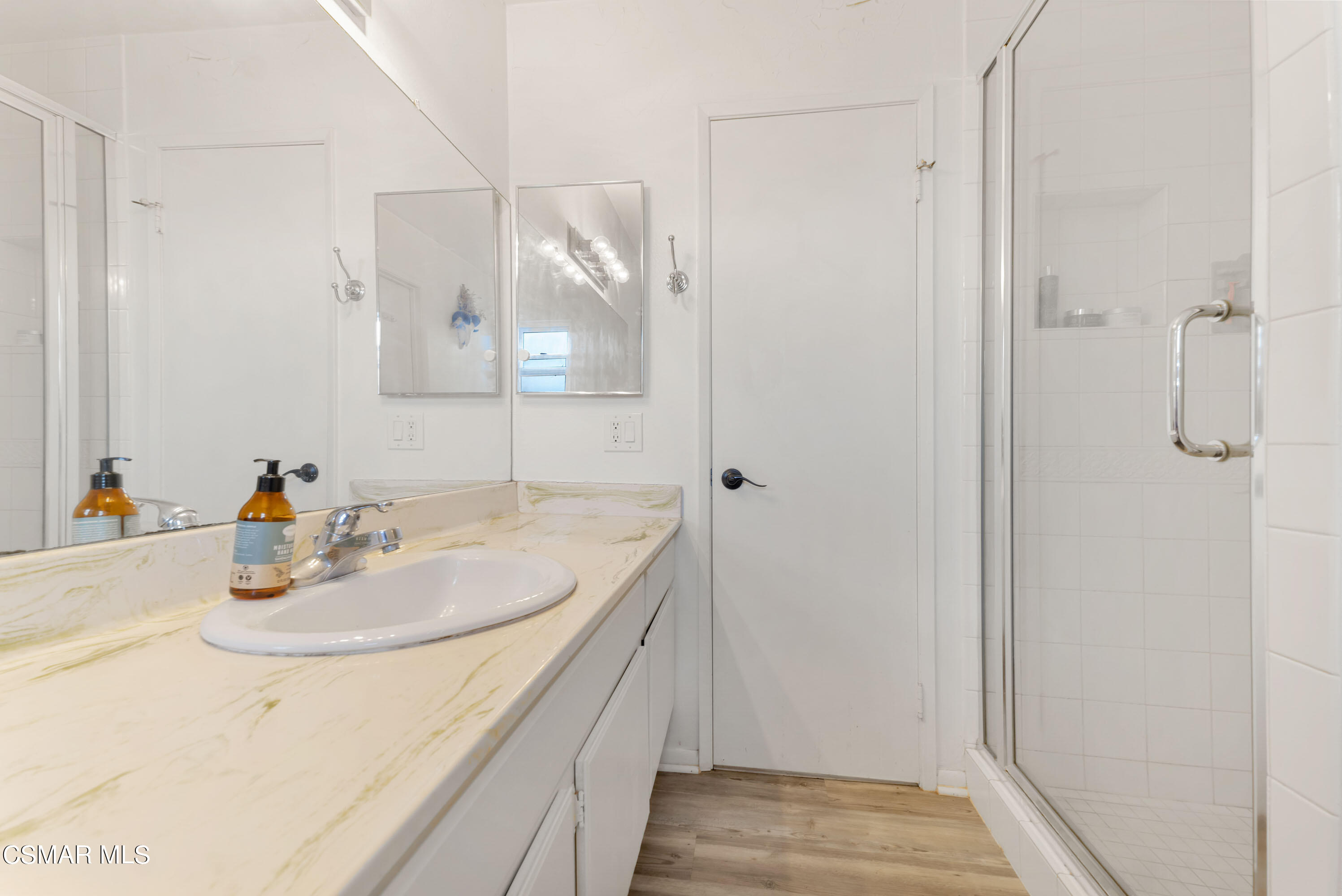 1065 Rambling Road Simi Valley, CA 93065 - Photo 44 of 54 a bathroom with a sink and a mirror