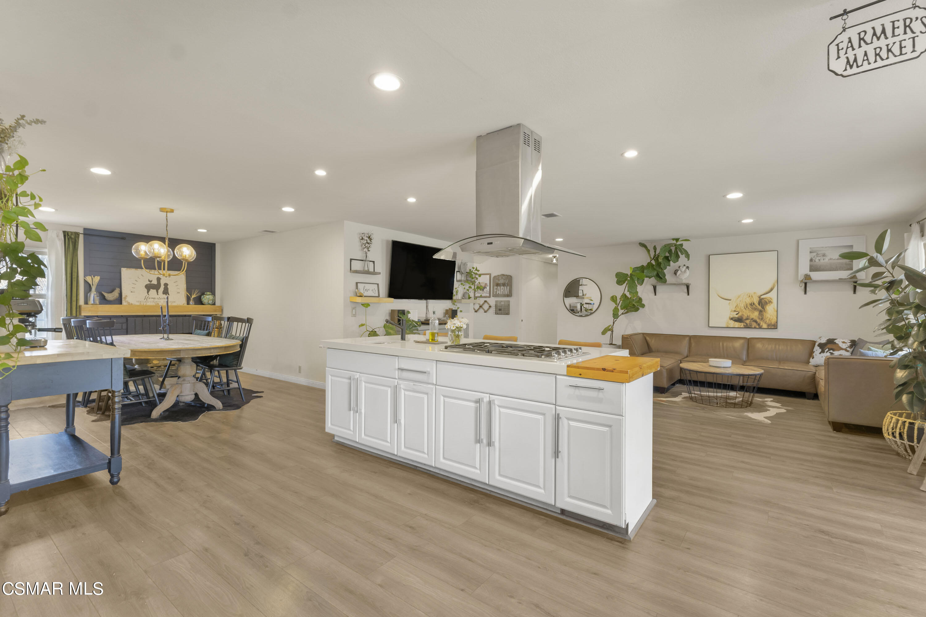 1065 Rambling Road Simi Valley, CA 93065 - Photo 48 of 54 a kitchen with stainless steel appliances kitchen island granite countertop a sink and a stove top oven
