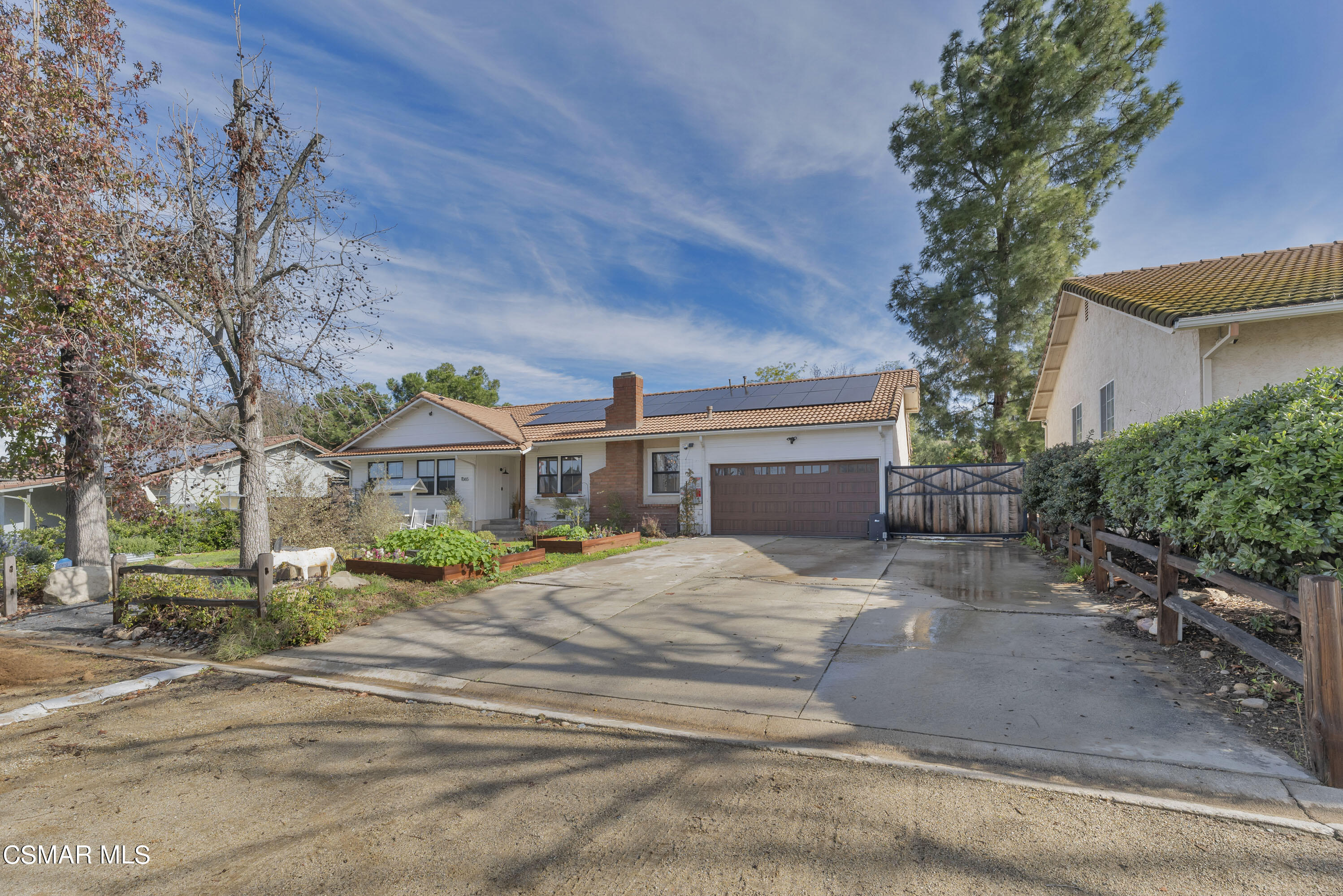 1065 Rambling Road Simi Valley, CA 93065 - Photo 54 of 54 a front view of a house with a yard and garage