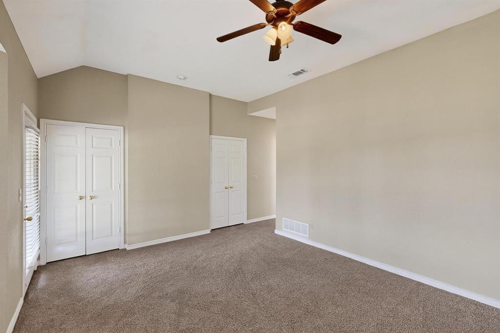 2104 Old McGarrah Road McKinney, TX 75072 - Photo 17 of 39 an empty room with a ceiling fan and a window