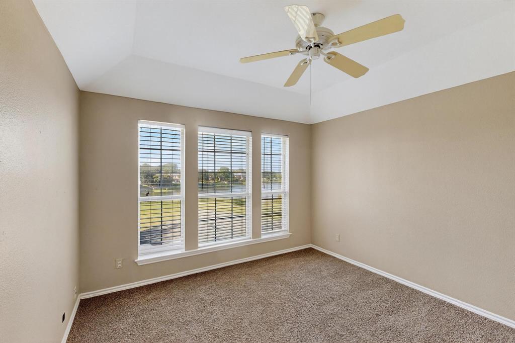2104 Old McGarrah Road McKinney, TX 75072 - Photo 26 of 39 an empty room with windows and fan