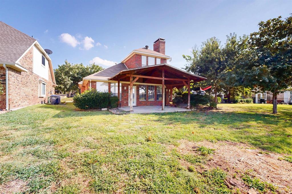 2104 Old McGarrah Road McKinney, TX 75072 - Photo 37 of 39 a view of a house with a yard